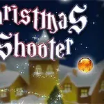 Juldekorationer och ljus framför ett snötäckt hus med texten Christmas Shooter i gotisk stil ovanför