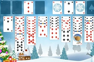 Kortspel arrangerat på ett vintertema med en julgran, snötäckta träd och ett hus i bakgrunden